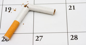 broken cigarette on top of calendar