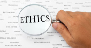 the word "ethics" under magnifying glass